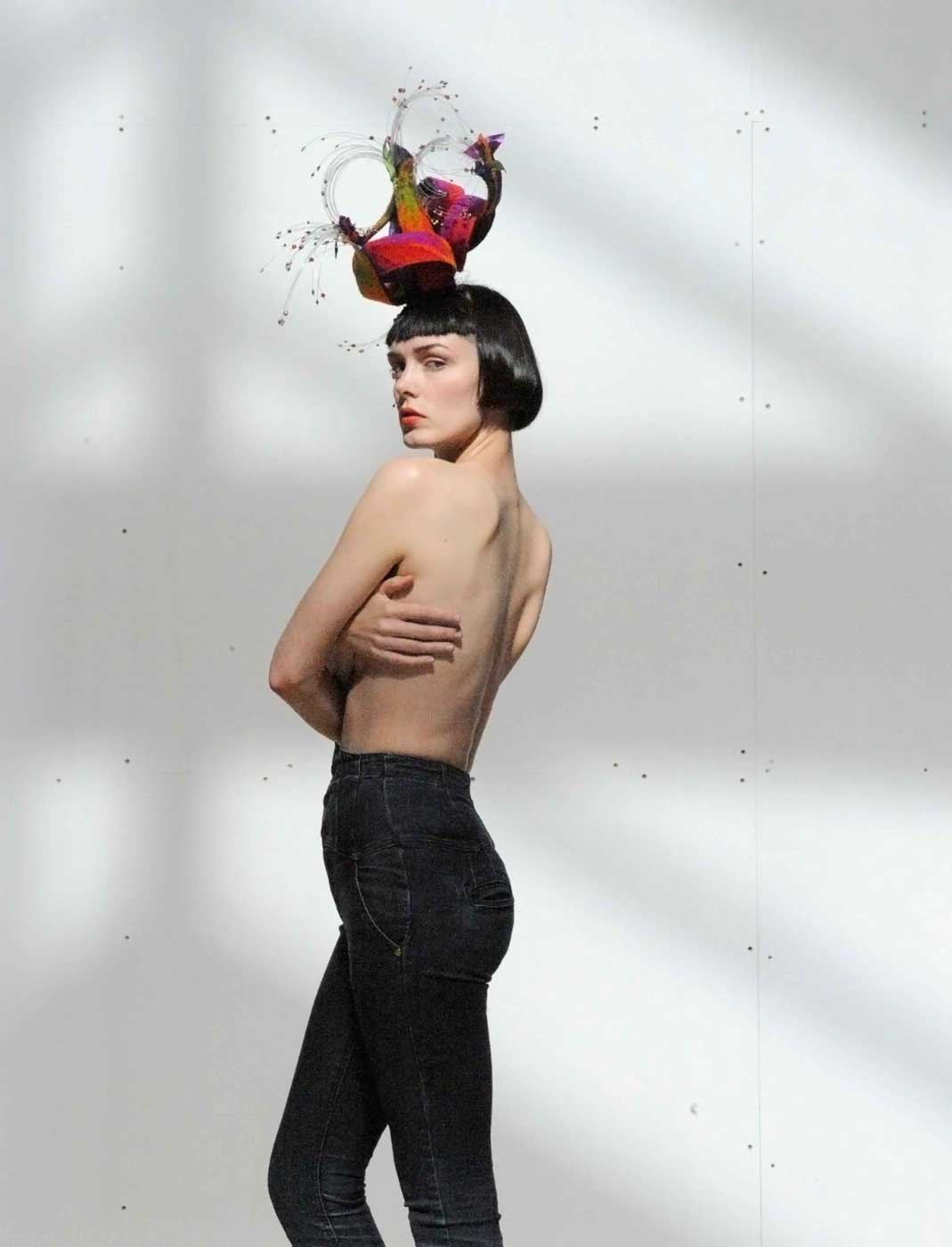 Fashion Photography: female topless with red fascinator