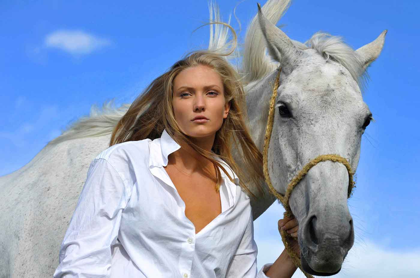 Fashion Photography: female in white blouse with horse